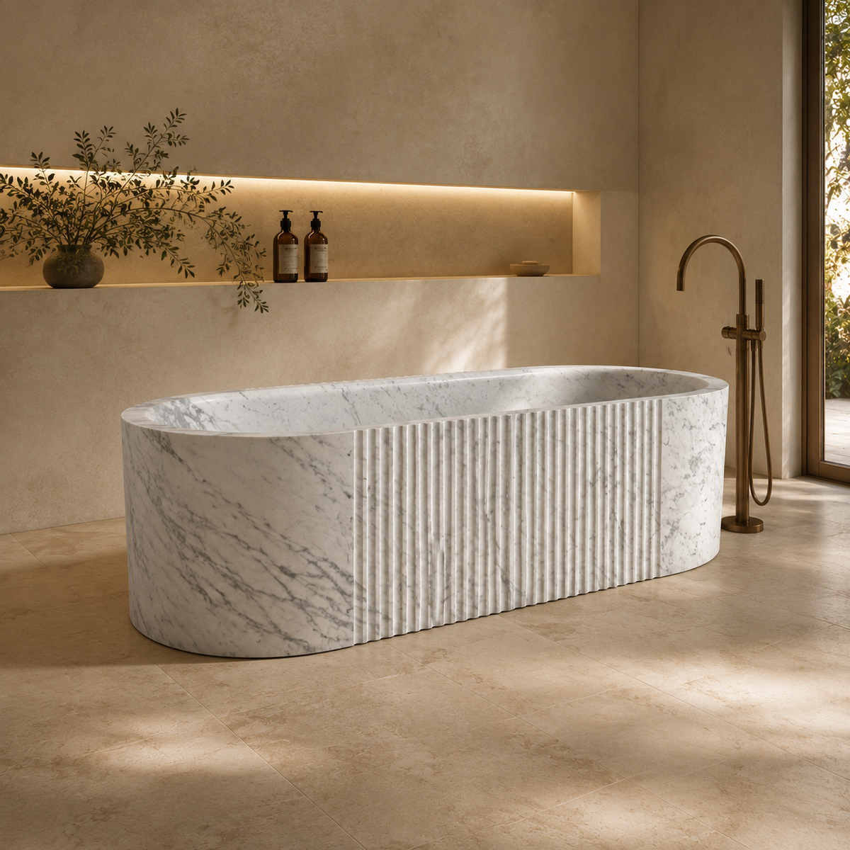 Rivara Fluted Rounded-Rectangle Freestanding Soaking Bathtub – Carrara White Marble — hero lifestyle in a warm architectural bathroom