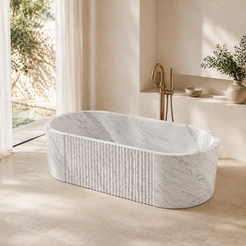 Rivara Fluted Rounded-Rectangle Freestanding Soaking Bathtub – Carrara White Marble — complementary lifestyle in a warm stone spa bathroom