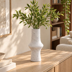 RoundHaven Carrara marble decorative vase, left oblique view in a warm natural-light interior