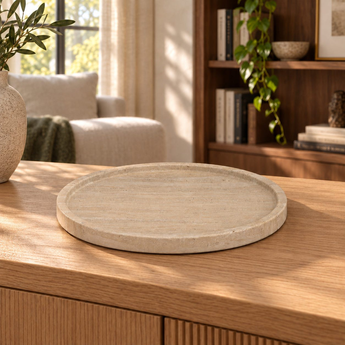 RoundHaven Classico travertine decorative tray, front view in a warm natural-light interior