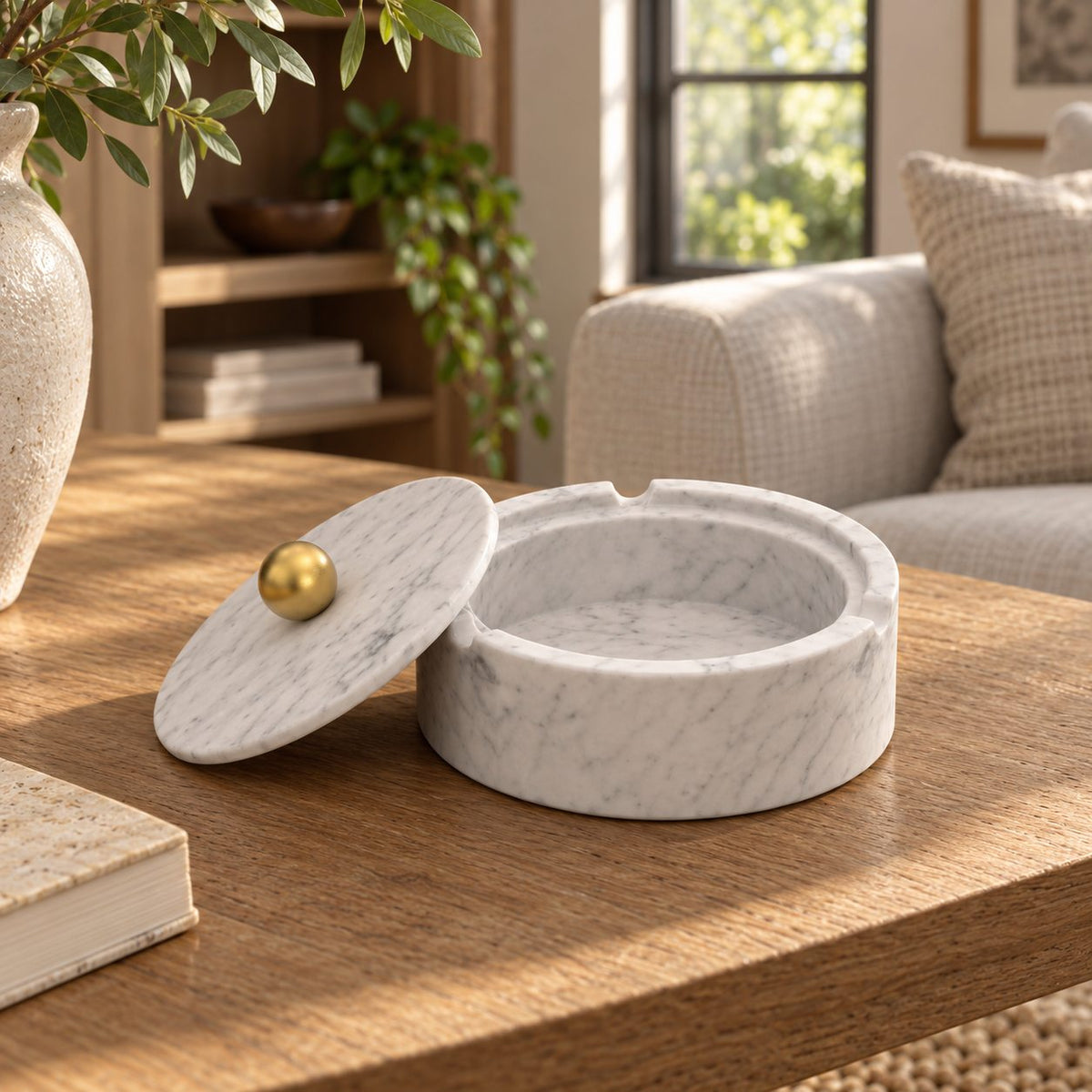 RoundHaven Stone Ashtray, Italian Carrara Marble, single configuration in a warm naturally lit oak interior