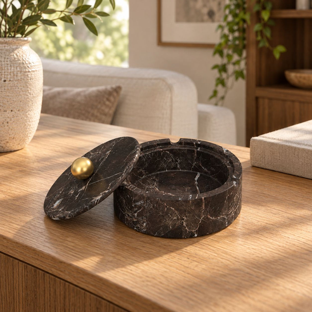 RoundHaven Stone Ashtray, Spanish Emperador Marble, single configuration in a warm naturally lit oak interior