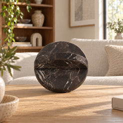 RoundHaven Spanish Emperador marble interlocking disc sculpture, frontal view on a warm oak console