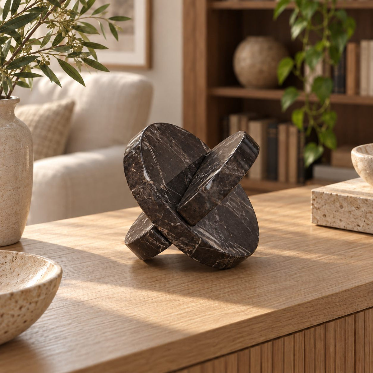 RoundHaven Spanish Emperador marble interlocking disc sculpture, right oblique view in a warm sunlit interior