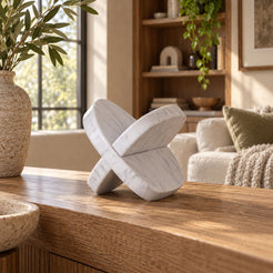 SquareSoft Carrara marble interlocking soft-square sculpture, rear oblique view in a warm naturally lit room
