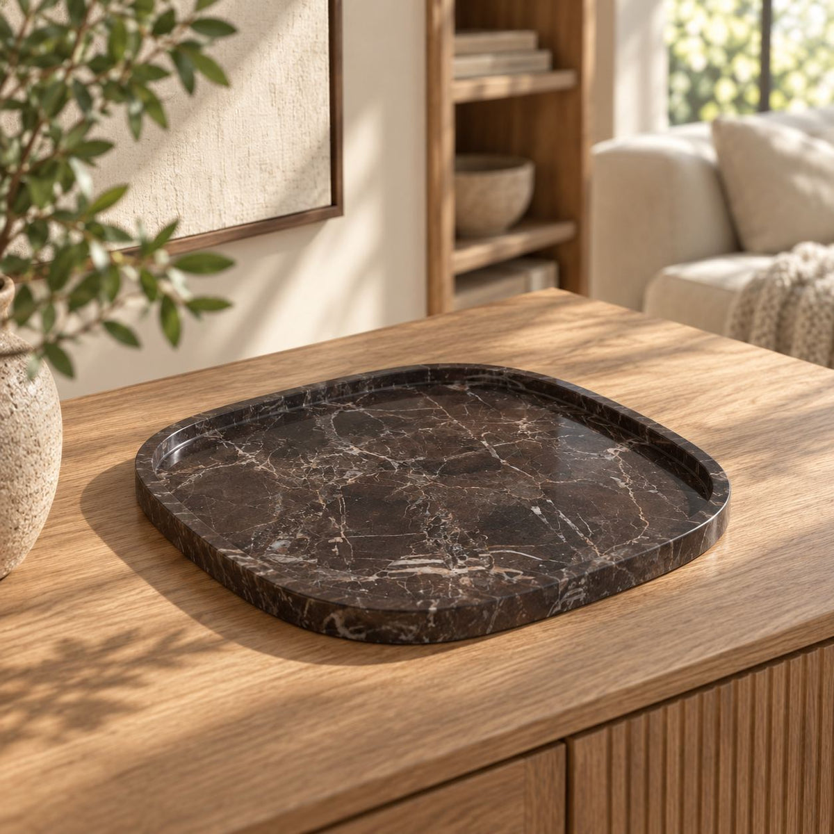 SquareSoft Spanish Emperador marble decorative tray, left oblique view on a warm oak console