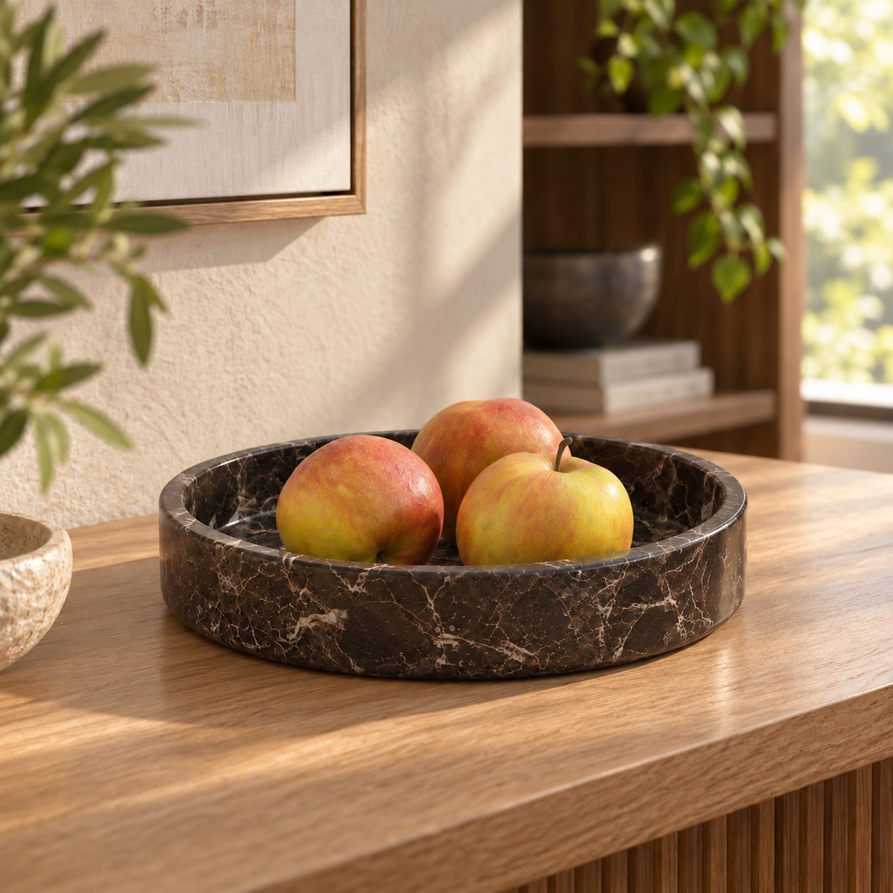 RoundHaven Spanish Emperador marble fruit tray, low front view in a warm naturally lit interior