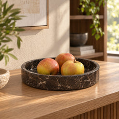 RoundHaven Spanish Emperador marble fruit tray, low front view in a warm naturally lit interior