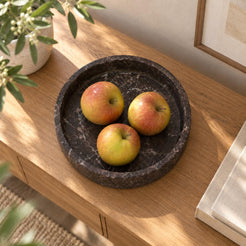 RoundHaven Spanish Emperador marble fruit tray, high overhead view in a warm naturally lit interior