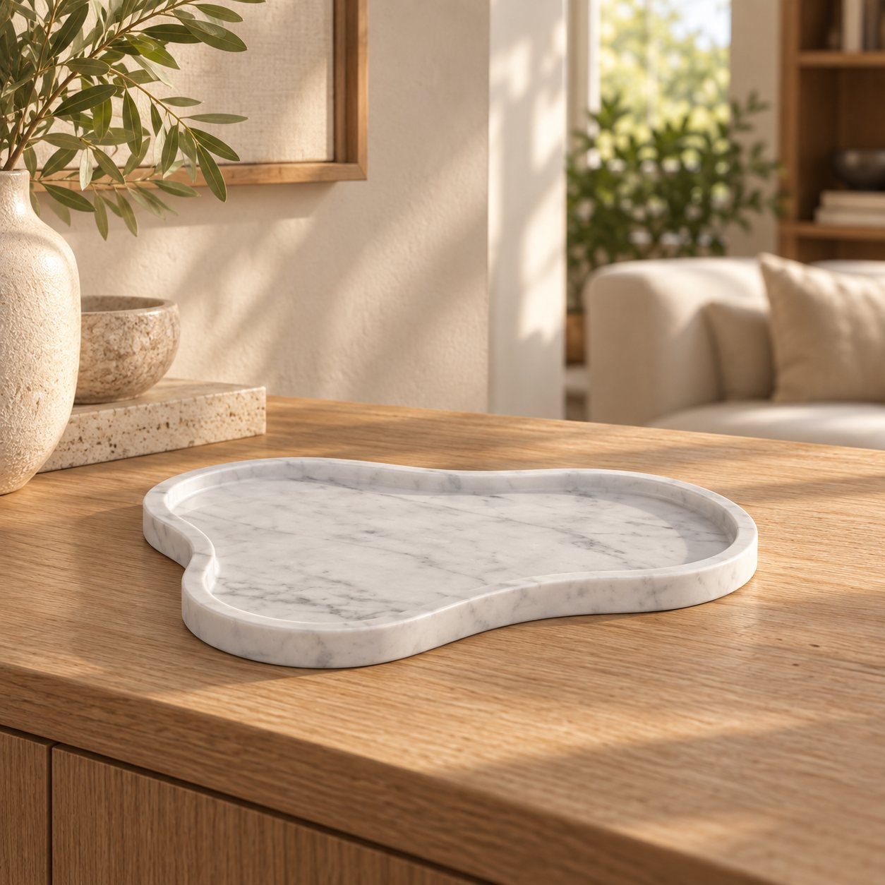 CloudDream Italian Carrara marble decorative tray, low front view in a warm naturally lit interior