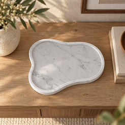 CloudDream Italian Carrara marble decorative tray, high overhead view in a warm naturally lit interior