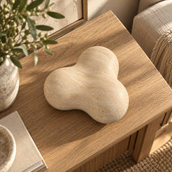 CloudDream Italian Classico travertine tabletop decor, high overhead view in a warm naturally lit interior