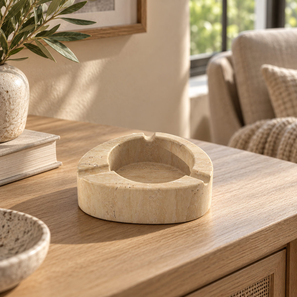 SwanEgg Marble Ashtray, Italian Classico Travertine, single configuration, front view in a warm naturally lit interior