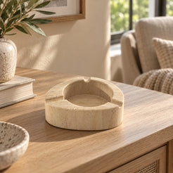 SwanEgg Marble Ashtray, Italian Classico Travertine, single configuration, front view in a warm naturally lit interior
