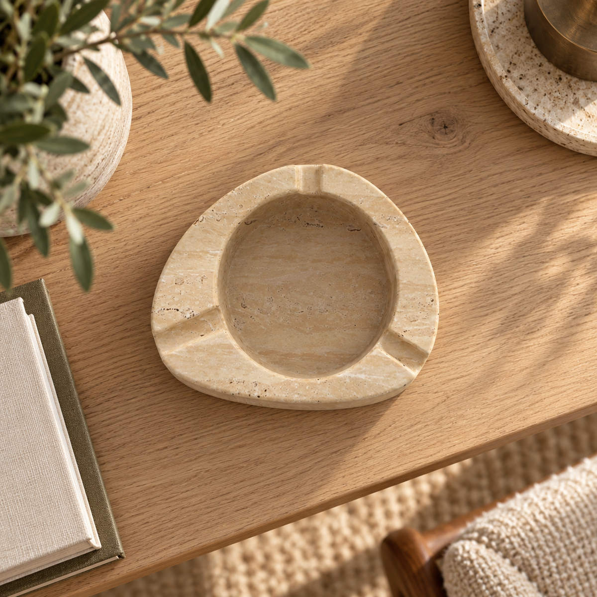 SwanEgg Marble Ashtray, Italian Classico Travertine, single configuration, high or overhead view in a warm naturally lit interior