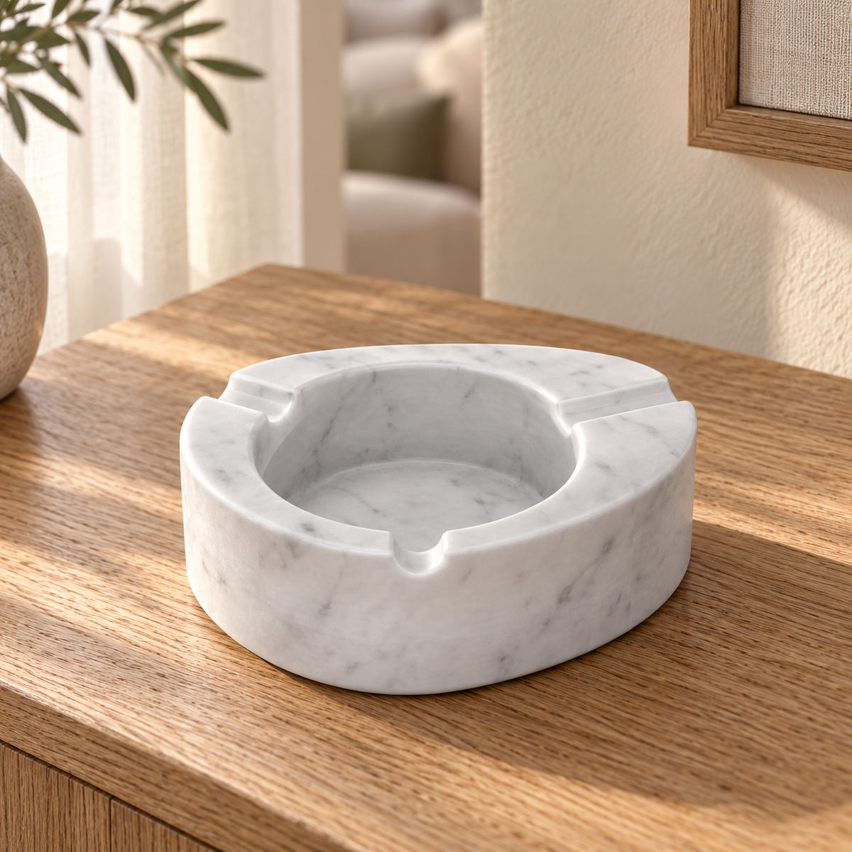 SwanEgg Marble Ashtray in Italian Carrara Marble in warm natural home light, one complete product