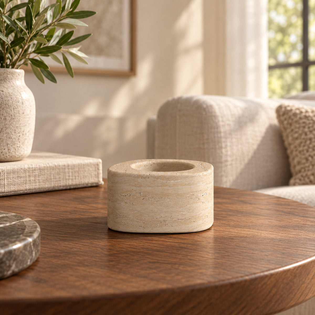 ZenPebble Candle Holders, Italian Classico Travertine / Short, single configuration, front view in a warm naturally lit interior