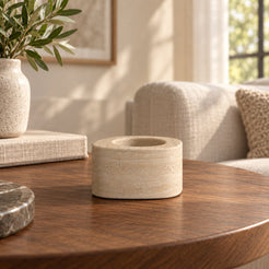 ZenPebble Candle Holders, Italian Classico Travertine / Short, single configuration, front view in a warm naturally lit interior