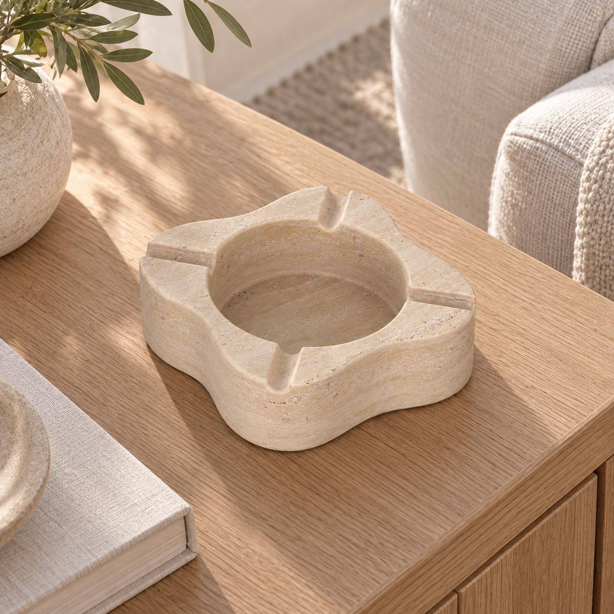 LakeMist Marble Ashtray, high left three-quarter, warm natural light in a premium home interior