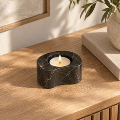 PeaPod Marble Candle Holders, high left Short-model three-quarter, warm natural light in a premium home interior