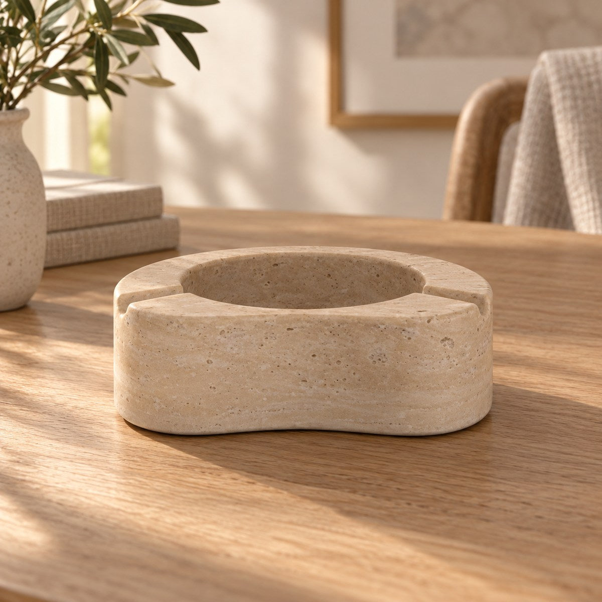 PeaPod Marble Ashtray, low frontal bean ashtray Hero, warm natural light in a premium home interior