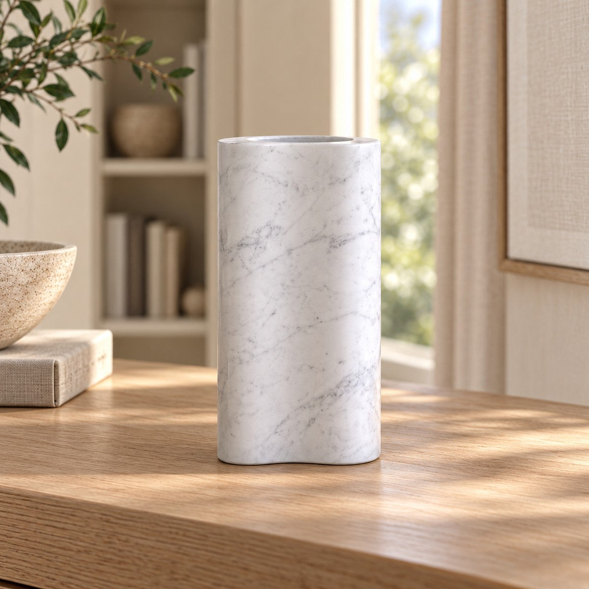 PeaPod Decorative Vases, low frontal white-Carrara bean vase Hero, warm natural light in a premium home interior