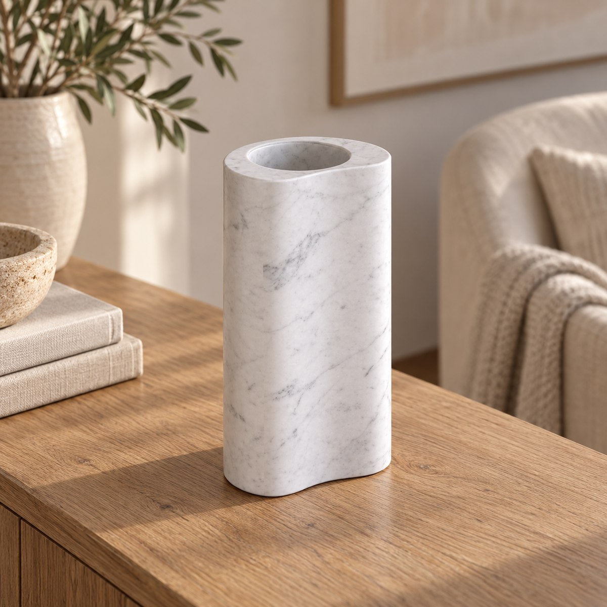 PeaPod Decorative Vases, left three-quarter hollow bean vase, warm natural light in a premium home interior