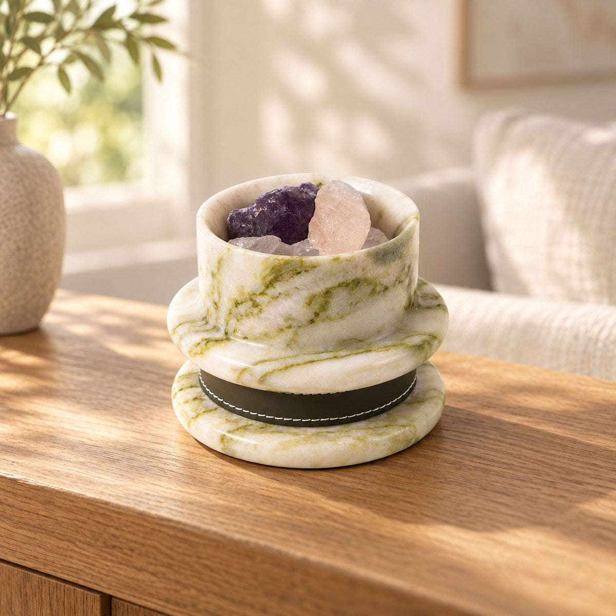 GreenAura Stone Aroma Diffuser, low frontal GreenAura assembly Hero, warm natural light in a premium home interior