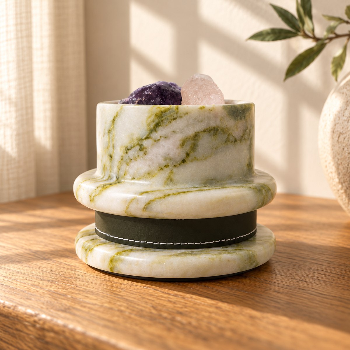 GreenAura Stone Aroma Diffuser, low eye-level opposite GreenAura, warm natural light in a premium home interior