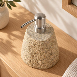Rustic Stone Soap Dispenser - Cobble Pebble Stones, very high left Rustic Stone dispenser, warm natural light in a premium home interior