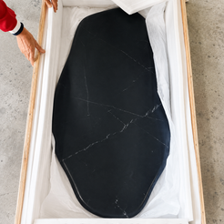 Actual AquaFlow Black Marquina marble tabletop protected inside its custom shipping crate