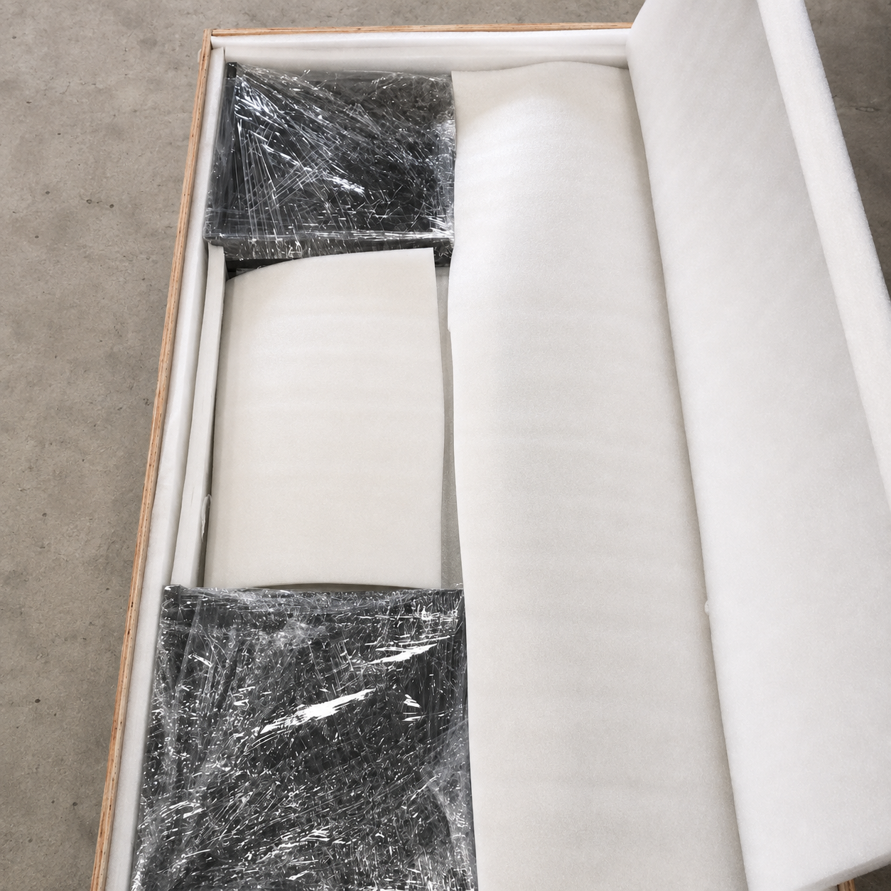 AquaFlow coffee table clear acrylic base components wrapped and protected inside the shipping crate
