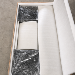 AquaFlow coffee table clear acrylic base components wrapped and protected inside the shipping crate