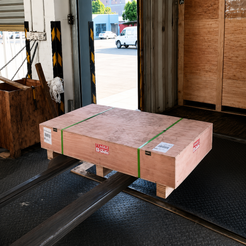 AquaFlow coffee table sealed in a custom wooden crate and prepared for freight shipment