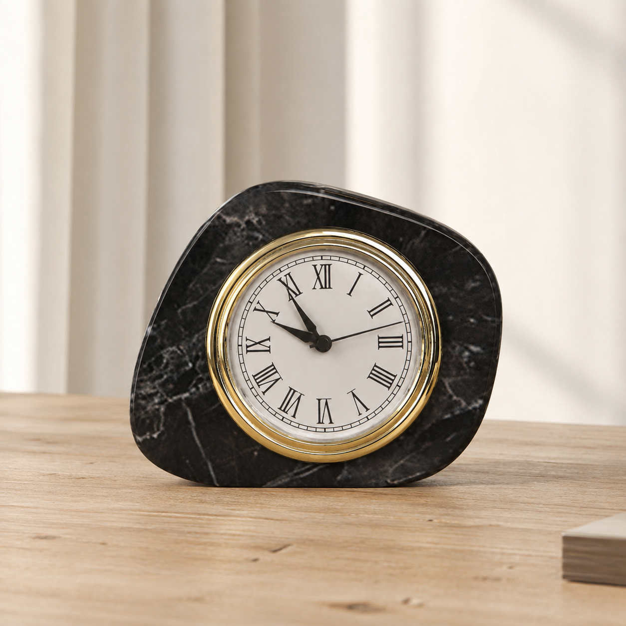 Black marble table clock styled in a warm neutral living room setting