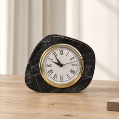 Black marble table clock styled in a warm neutral living room setting