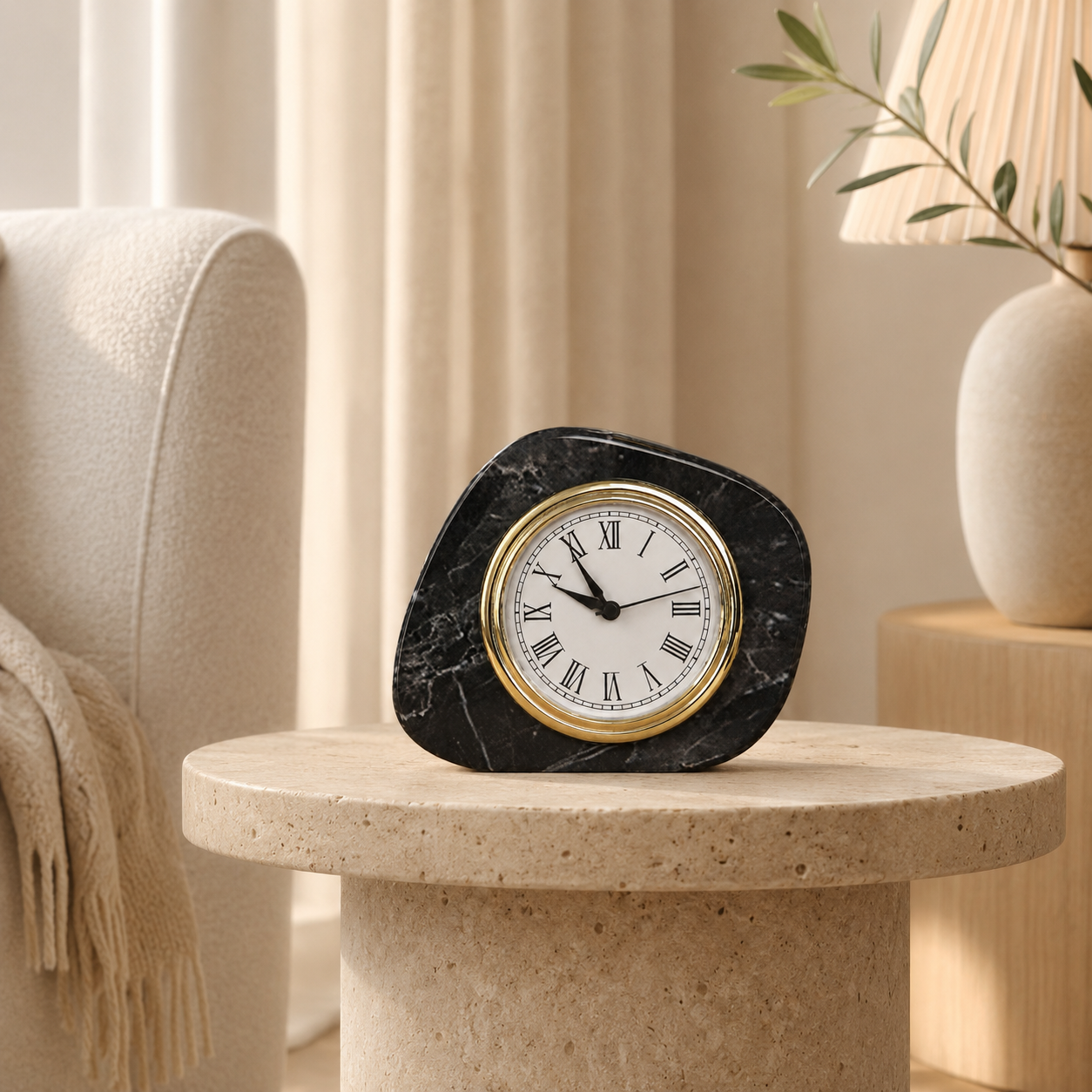 Black marble desk clock styled on a beige travertine stone table
