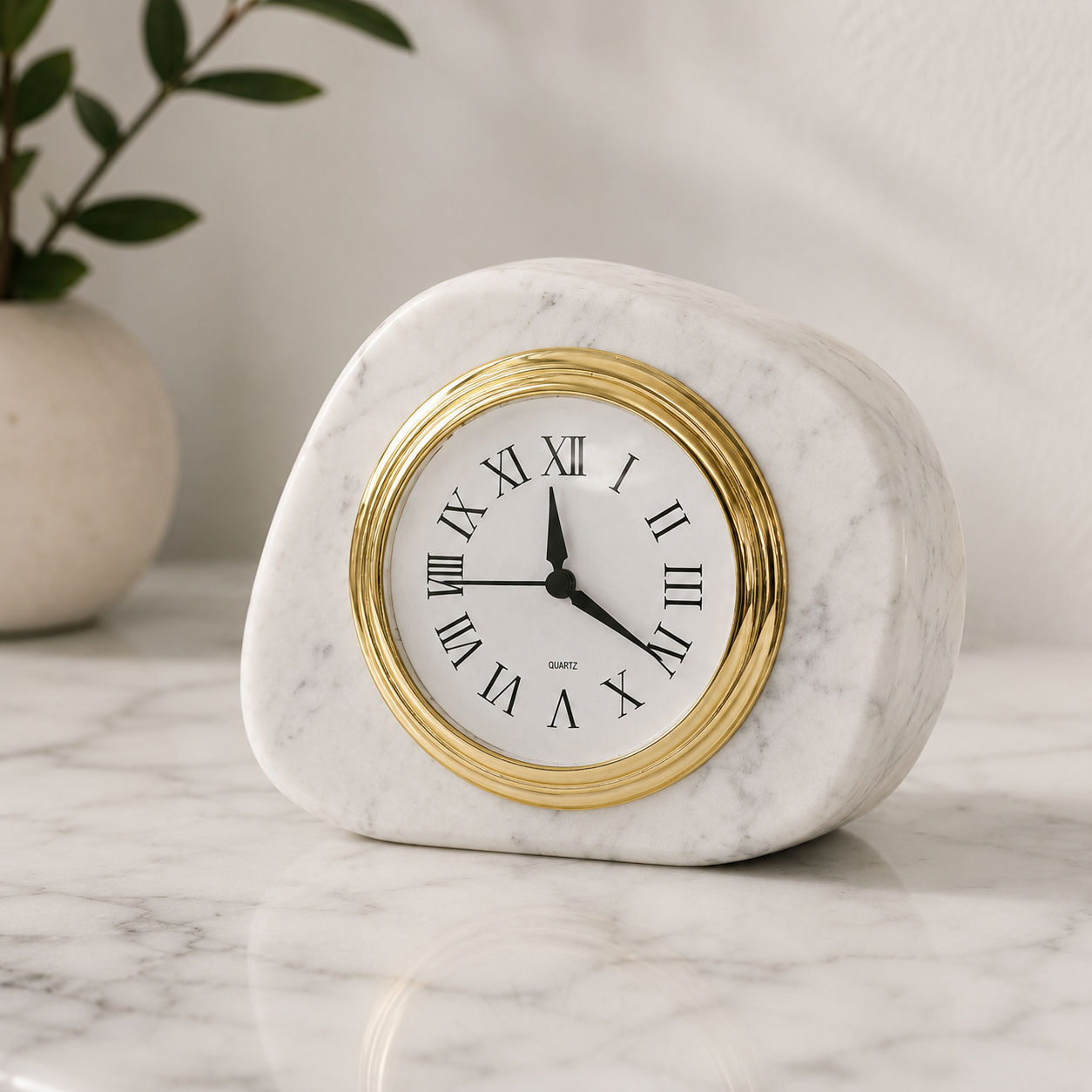 White marble desk clock styled in soft natural light with warm neutral decor