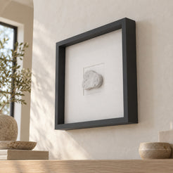 CloudDream Carrara marble wall frame decor, low right oblique view in a warm natural-light interior