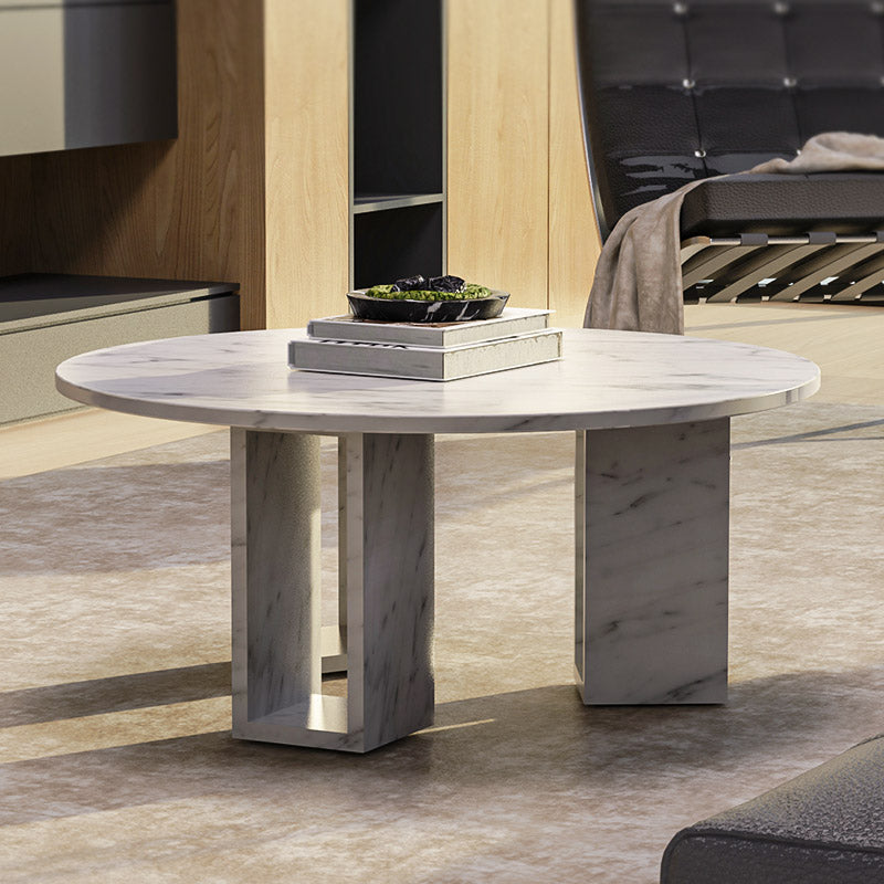 Round stone coffee table with geometric base design