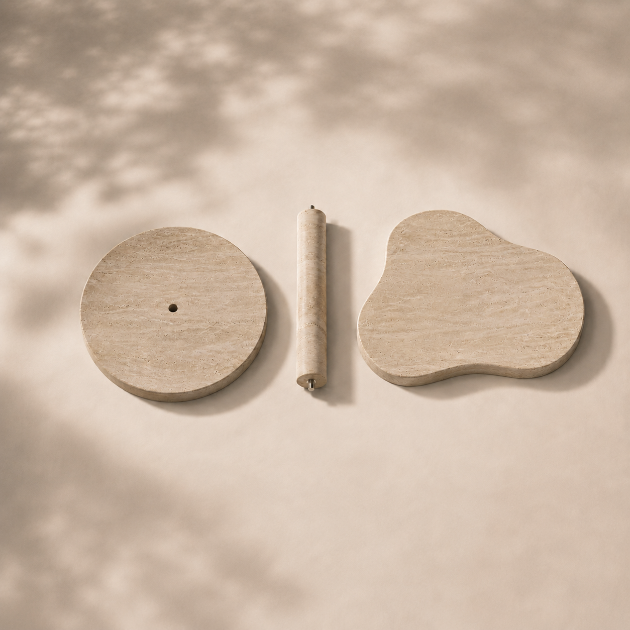 Modular natural stone table components arranged in a clean flat lay, highlighting practical assembly and thoughtful design