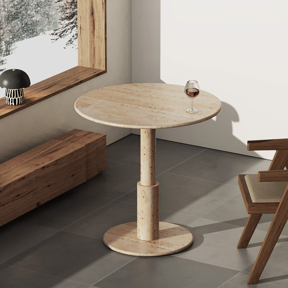 RoundTwin Elite travertine stone dining table in a warm modern interior by OIXDESIGN.