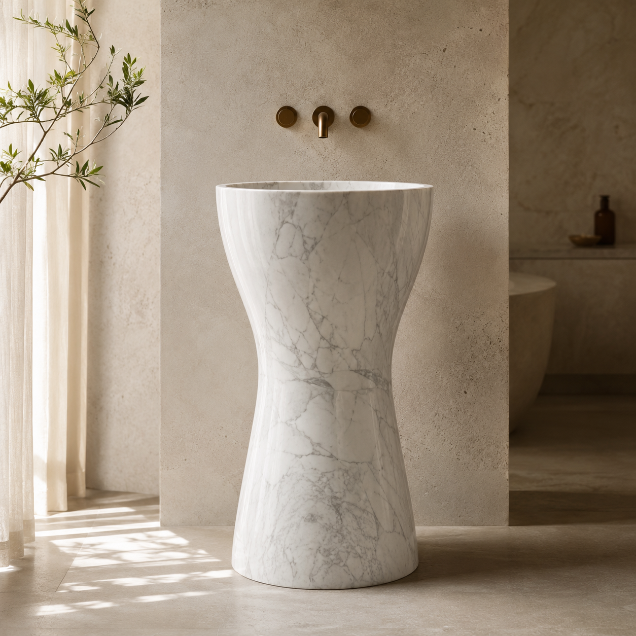 Sculptural natural stone pedestal sinks designed as statement pieces for refined bathroom interiors by OIXDESIGN.