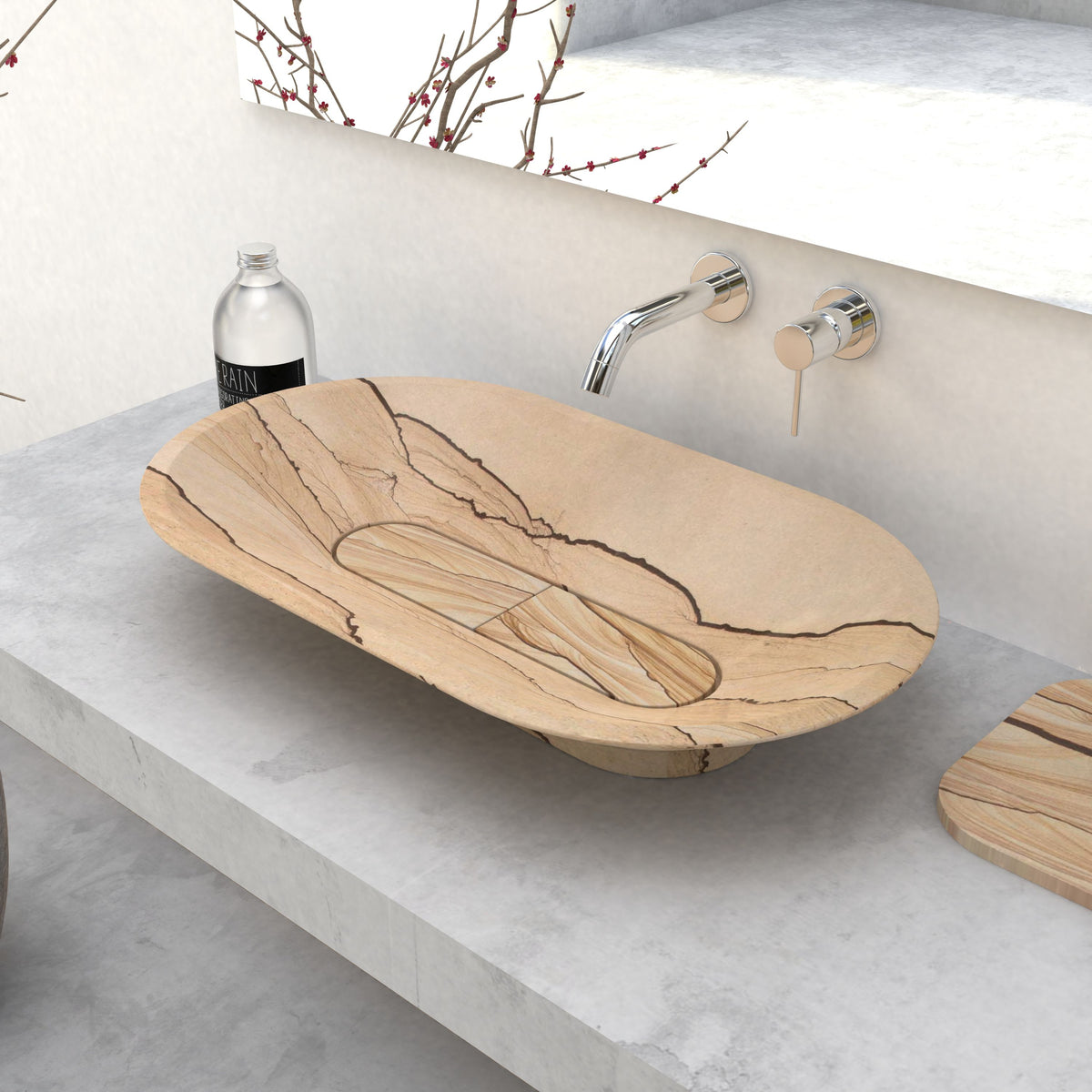 Angled view of the Selia sandstone vessel sink with dark natural veining