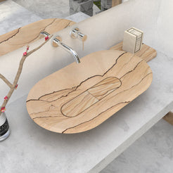 Selia oval sandstone vessel sink for a warm refined bathroom by OIXDESIGN.