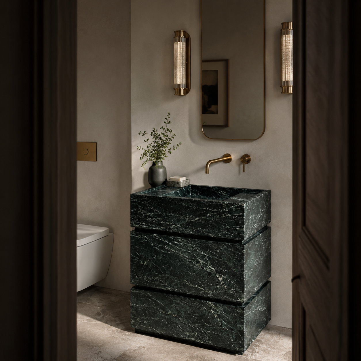 Elegant bathroom featuring a natural stone vanity with warm brass accents, creating a refined and timeless luxury interior by OIXDESIGN.