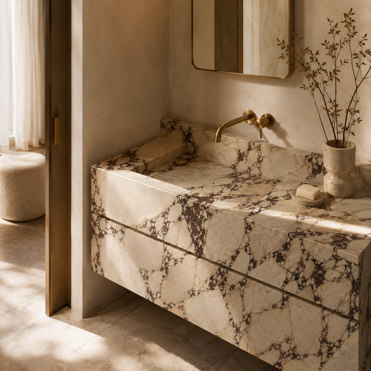 Luxury marble bathroom with a sculptural stone vanity and soft ambient lighting, designed to convey warmth, sophistication, and premium living by OIXDESIGN.