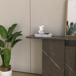 Close-up of the Thalia carved stone console table showing Bulgarian Gray marble texture and structure