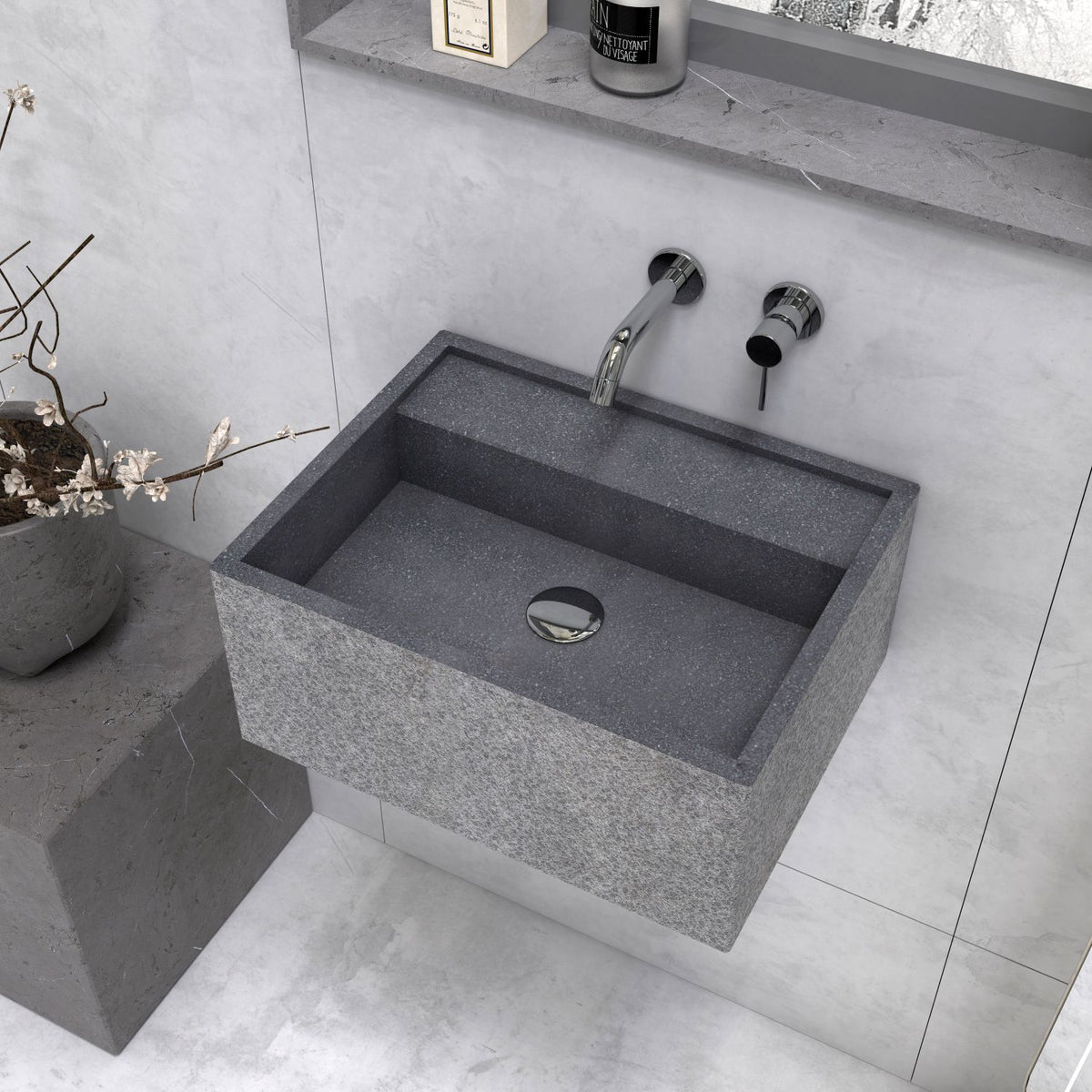 Angled overhead view of the Tibna Neroco stone basin and drain