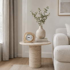 Travertine stone clock styled on a round side table in a soft neutral living room